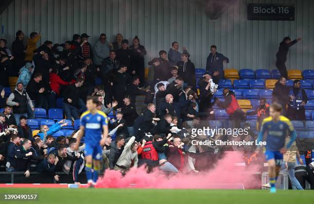Wimbledon supporters celebrate their sides first goal scored by Troy Parrot during the Sky Bet League One match between AFC Wimbledon and Milton...