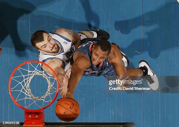 Nikola Pekovic of the Minnesota Timberwolves reaches for the ball against Boris Diaw of the Charlotte Bobcats during the game on February 15, 2012 at...
