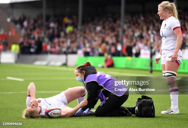 Abby Dow of England receives medical treatment during the TikTok Women's Six Nations match between England and Wales at Kingsholm Stadium on April...