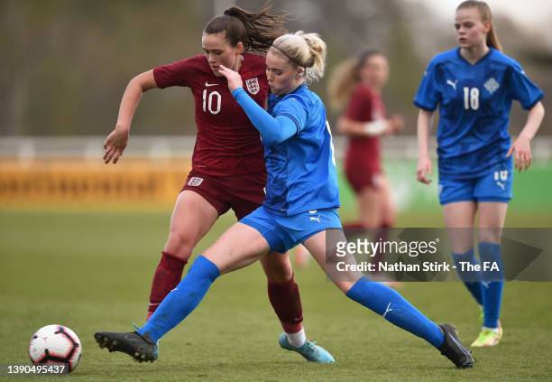 Grace Clinton of England U19 runs past Mikaela Petursdottir of Iceland during the UEFA European Women's Under-19 Championship Elite Round match...