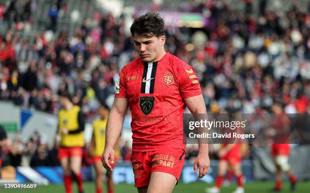 Antoine Dupont, the captain of Toulouse looks dejected as he walks off the pitch after their defeat during the Heineken Champions Cup match between...