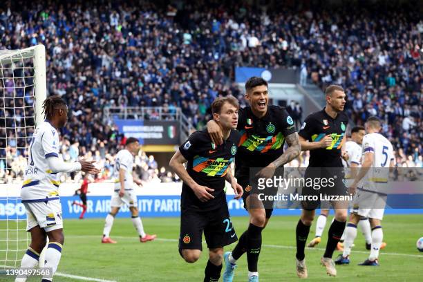 Nicolo Barella celebrates with teammate Joaquin Correa of FC Internazionale after scoring their team's first goal during the Serie A match between FC...