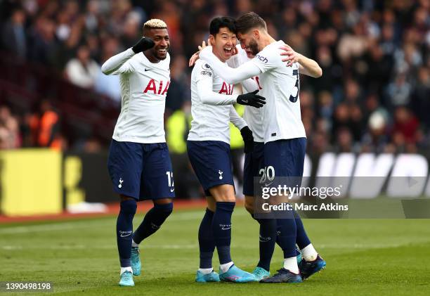 Heung-Min Son of Tottenham Hotspur celebrates after scoring their side's first goal with teammates during the Premier League match between Aston...