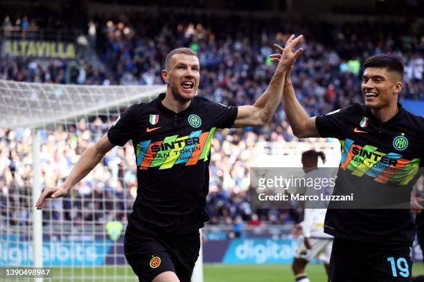 Edin Dzeko celebrates with teammate Joaquin Correa of FC Internazionale after scoring their team's second goal during the Serie A match between FC...