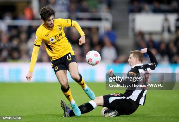 Francisco Trincao of Wolverhampton Wanderers is challenged by Matt Targett of Newcastle United during the Premier League match between Newcastle...
