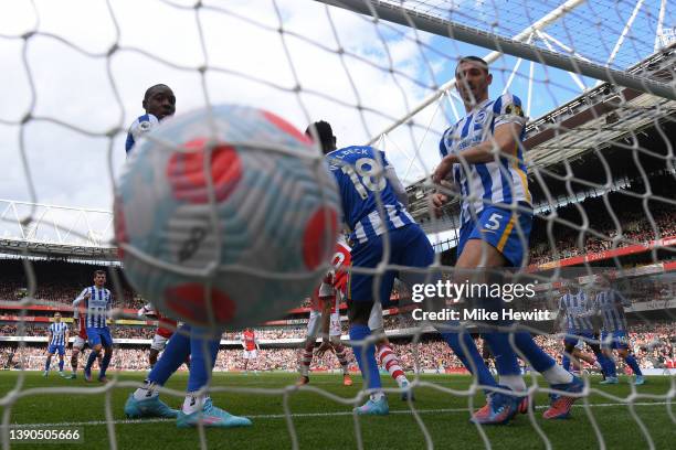 Enock Mwepu and Lewis Dunk of Brighton & Hove Albion watch as the ball hits the back of the net but the goal is rules ouit for offside during the...