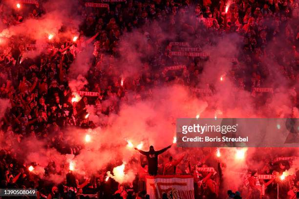Union Berlin fans light flares in the stands during the Bundesliga match between Hertha BSC and 1. FC Union Berlin at Olympiastadion on April 09,...