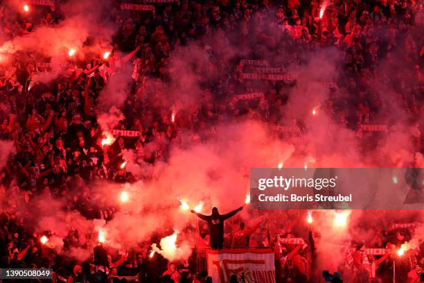 Union Berlin fans light flares in the stands during the Bundesliga match between Hertha BSC and 1. FC Union Berlin at Olympiastadion on April 09,...