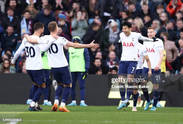 Heung-Min Son of Tottenham Hotspur celebrates after scoring their side's third goal with team mates during the Premier League match between Aston...