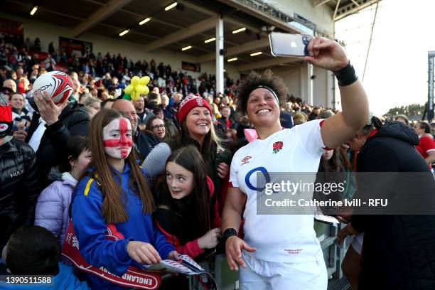 Shaunagh Brown of England takes a selfie with fans after their sides victory during the TikTok Women's Six Nations match between England and Wales at...