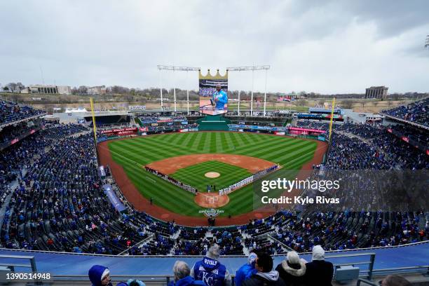 Kansas City Royals and the Cleveland Guardians lineup for the national anthem on Opening Day at Kauffman Stadium on April 7, 2022 in Kansas City,...