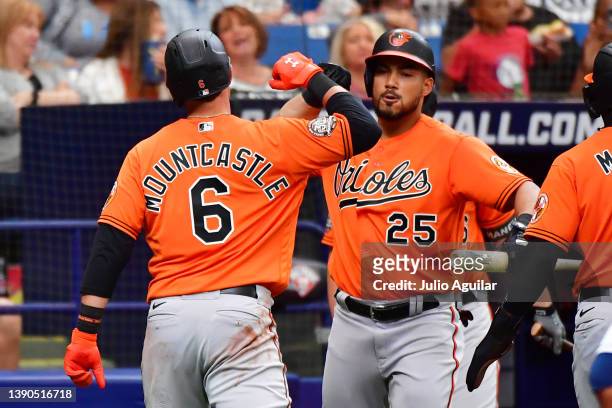 Ryan Mountcastle of the Baltimore Orioles celebrates with Anthony Santander after hitting a 2-run home run in the third inning against the Tampa Bay...