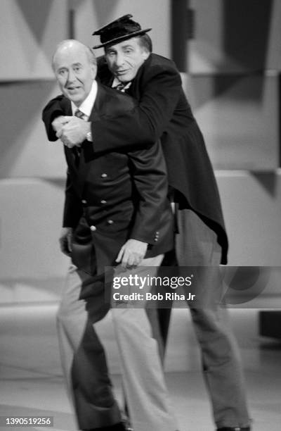 Comedy legends Sid Caesar and Carl Reiner perform during 'Comic Relief' fundraising concert, March 29, 1986 at Universal Amphitheater in Los Angeles,...