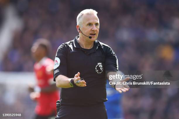 Referee Jon Moss gestures during the Premier League match between Everton and Manchester United at Goodison Park on April 09, 2022 in Liverpool,...