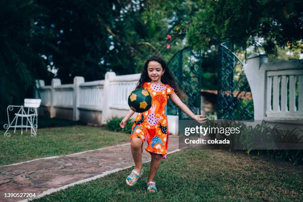 young girl playing soccer - brazil and outside and ball stock pictures, royalty-free photos & images