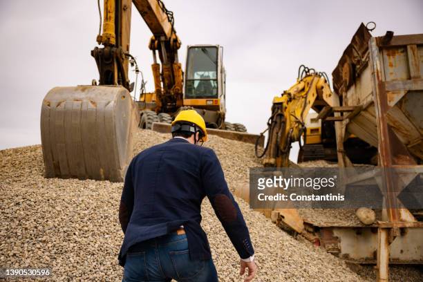 unrecognizable male small business owner at the sand separation site - person in suit construction stock pictures, royalty-free photos & images