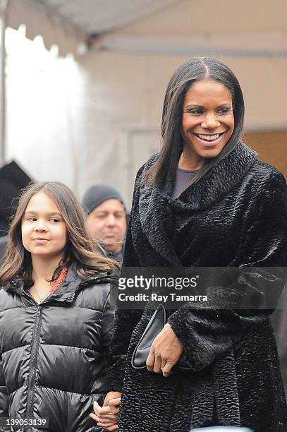 Actress Audra McDonald and her daughter Audra McDonald leave Fashion Week at Lincoln Center on February 15, 2012 in New York City.