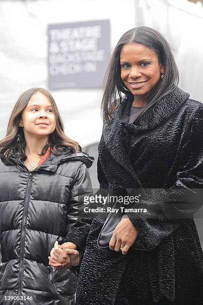 Actress Audra McDonald and her daughter Audra McDonald leave Fashion Week at Lincoln Center on February 15, 2012 in New York City.