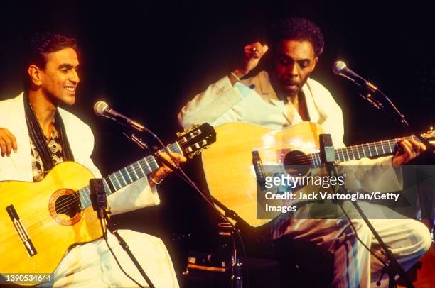 Brazilian composers & musicians Caetano Veloso and Gilberto Gil, both on acoustic guitar, perform during a JVC Jazz Festival concert at Lincoln...