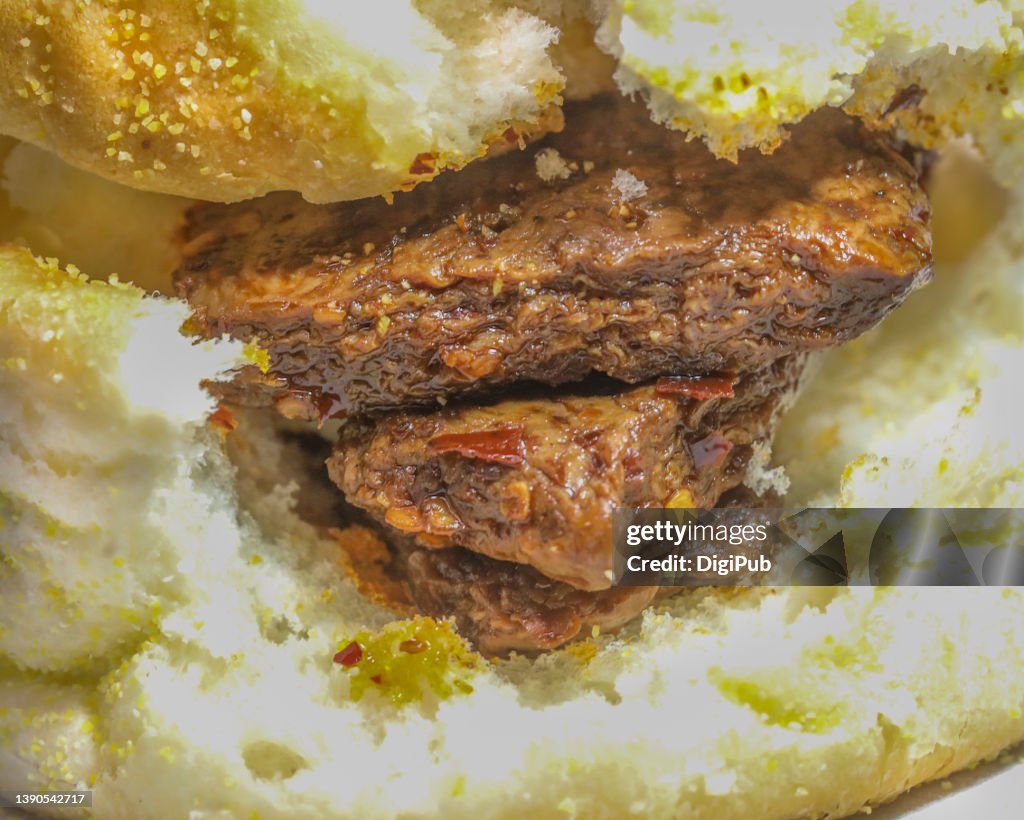 Mala flavored (chili hot and tongue numbing) vegetarian beef steak (bean curd) in English muffin