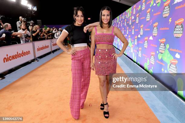 Brie Bella and Nikki Bella attend the Nickelodeon's Kids' Choice Awards 2022 at Barker Hangar on April 09, 2022 in Santa Monica, California.