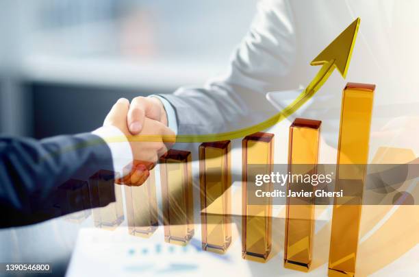 economy graph: handshake and rising arrow - trade agreement stock pictures, royalty-free photos & images