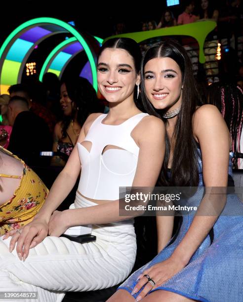 Dixie D’Amelio and Charli D'Amelio attend the 2022 Nickelodeon Kid's Choice Awards at Barker Hangar on April 09, 2022 in Santa Monica, California.