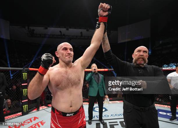 Aleksei Oleinik of Russia reacts after his submission victory over Jared Vanderaa in their heavyweight fight during the UFC 273 event at VyStar...