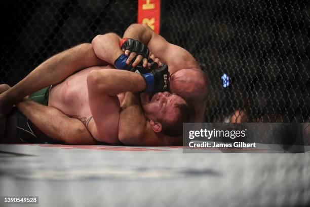 Aleksei Oleinik of Russia submits Jared Vanderaa during the Heavyweight bout at UFC 273 at VyStar Veterans Memorial Arena on April 09, 2022 in...