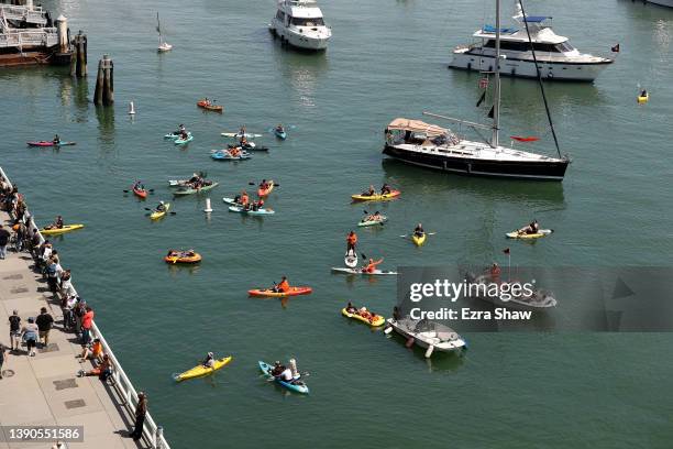 Boats and kayaks cruise around McCovey Cove during their opening day game between the San Francisco Giants and the Miami Marlins at Oracle Park on...