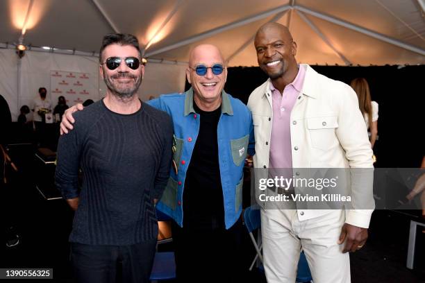 Simon Cowell, Howie Mandel, and Terry Crews are seen at Cold Stone Creamery backstage during the 2022 Nickelodeon Kids' Choice Awards at Barker...