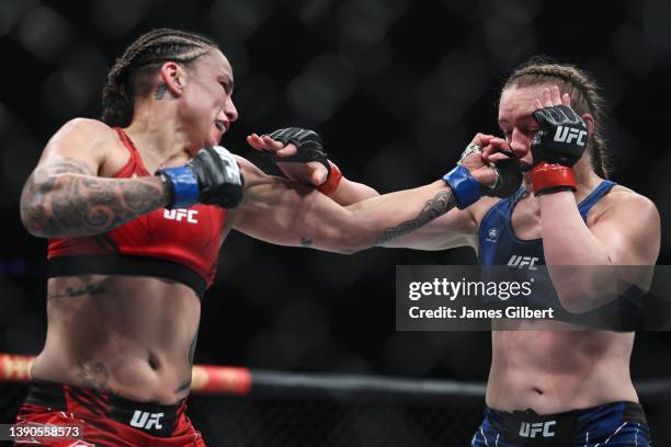 Raquel Pennington punches Aspen Ladd in a bantemweight bout during the UFC 273 event at VyStar Veterans Memorial Arena on April 09, 2022 in...