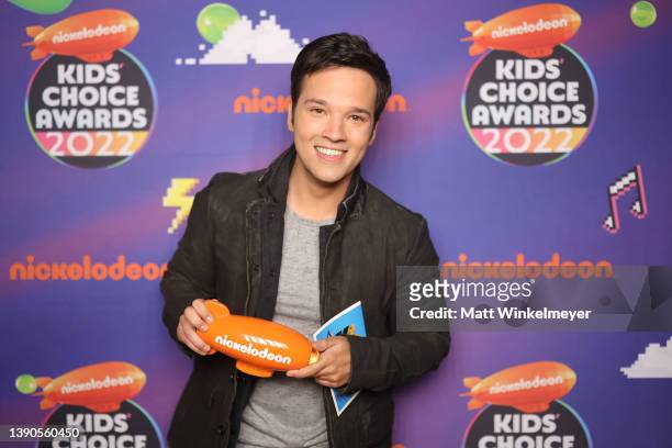 Nathan Kress poses backstage with the award for Favorite Family TV Show at the Nickelodeon's Kids' Choice Awards 2022 at Barker Hangar on April 09,...