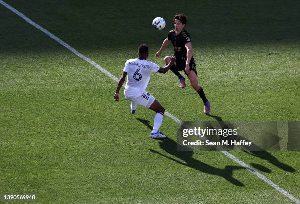 Rayan Raveloson of Los Angeles Galaxy defends agains Ilie Sánchez of Los Angeles FC during the first half of a game at Dignity Health Sports Park on...