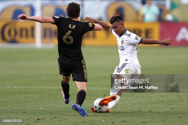 Efrain Alvarez of Los Angeles Galaxy controls the ball as Ilie Sánchez of Los Angeles FC defends during the second half of a game at Dignity Health...