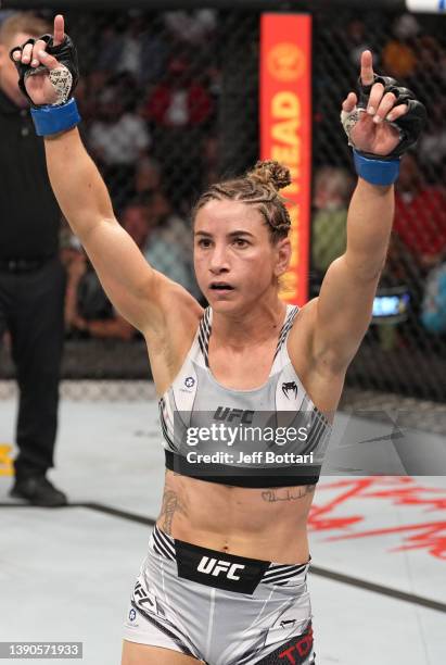 Tecia Torres reacts after her battle against Mackenzie Dern in their strawweight fight during the UFC 273 event at VyStar Veterans Memorial Arena on...