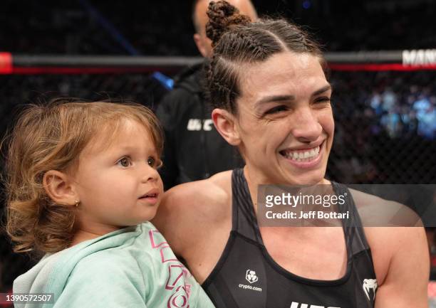 Mackenzie Dern reacts after her victory over Tecia Torres in their strawweight fight during the UFC 273 event at VyStar Veterans Memorial Arena on...