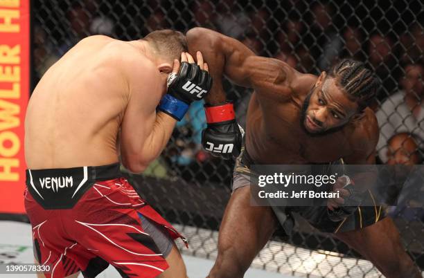 Aljamain Sterling elbows Petr Yan of Russia in their UFC bantamweight championship fight during the UFC 273 event at VyStar Veterans Memorial Arena...