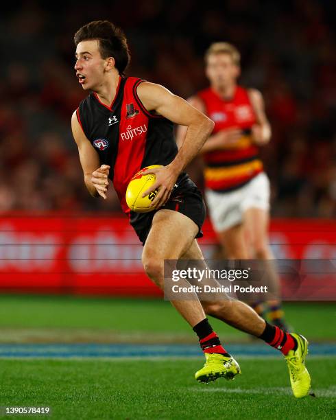 Nicholas Martin of the Bombers runs with the ball during the round four AFL match between the Essendon Bombers and the Adelaide Crows at Marvel...