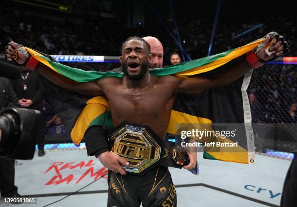 Aljamain Sterling celebrates after defeating Petr Yan of Russia in their UFC bantamweight championship fight during the UFC 273 event at VyStar...