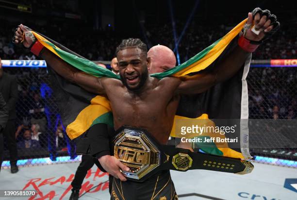 Aljamain Sterling celebrates after defeating Petr Yan of Russia in their UFC bantamweight championship fight during the UFC 273 event at VyStar...