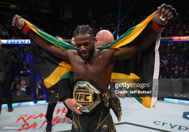 Aljamain Sterling celebrates after defeating Petr Yan of Russia in their UFC bantamweight championship fight during the UFC 273 event at VyStar...