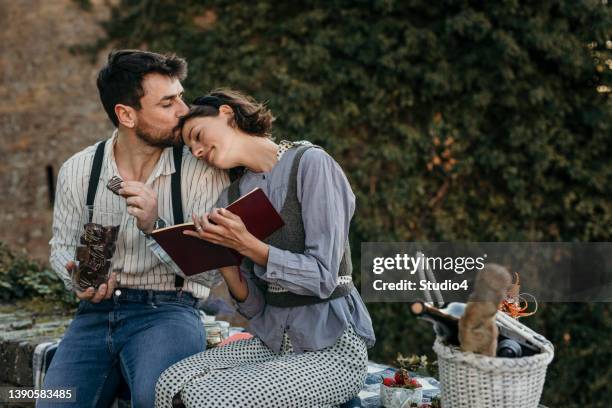 newly weds having their time vacation - romantic picnic stockfoto's en -beelden