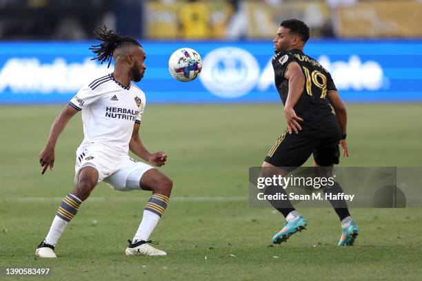 Ismael Tajouri of Los Angeles FC and Raheem Edwards of Los Angeles Galaxy battle for a loose ball during the second half of a game at Dignity Health...