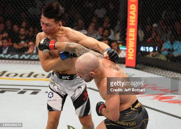 Alexander Volkanovski of Australia punches 'The Korean Zombie' Chan Sung Jung of South Korea in their UFC featherweight championship fight during the...