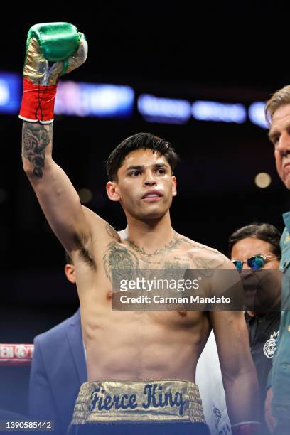 Ryan Garcia gestures to the crowd prior to facing Emmanuel Tagoe in their Lightweight bout at the Alamodome on April 09, 2022 in San Antonio, Texas.