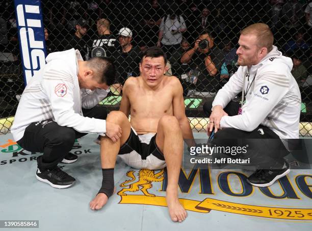 The Korean Zombie' Chan Sung Jung of South Korea reacts after his TKO loss to Alexander Volkanovski of Australia in their UFC featherweight...