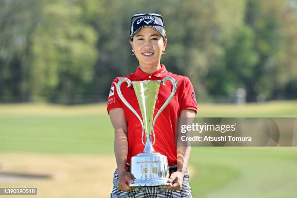 Momoko Ueda of Japan poses with the trophy after winning the tournament following the final round of the Fujiflim Studio Alice Ladies Open at...