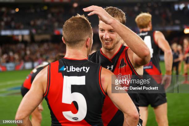 Darcy Parish of the Bombers hugs Devon Smith of the Bombers after winning the round four AFL match between the Essendon Bombers and the Adelaide...
