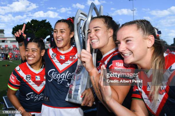 Simone Karpani, Corban Baxter, Isabelle Kelly and Brydie Parker pose after their victory during the NRLW Grand Final match between the St George...
